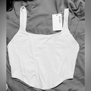 NWT White corset top with adjustable straps Zipper closure in back Has stretch